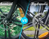 Porównanie hamulców tarczowych: mechaniczne vs hydrauliczne. Widok z bliska na zaciski i tarcze rowerowe.