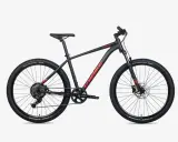 Czarny rower górski Unibike Mission z czerwonym logo. To polska firma, która tworzy rowery dla aktywnych.