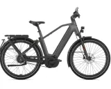 Szary rower elektryczny Gazelle z bagażnikiem i oświetleniem, jeden z najszybszych rowerów elektrycznych na rynku.