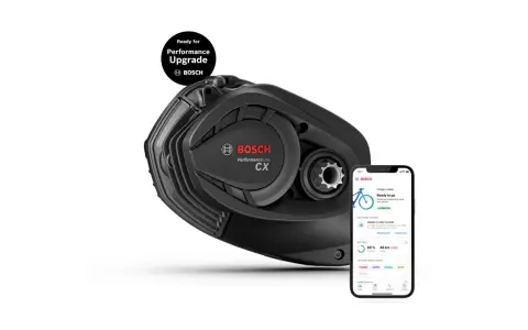 Silnik Bosch Performance CX Gen 5 do e-bike'a, gotowy na aktualizację. Obok smartfon z aplikacją Bosch eBike Flow.